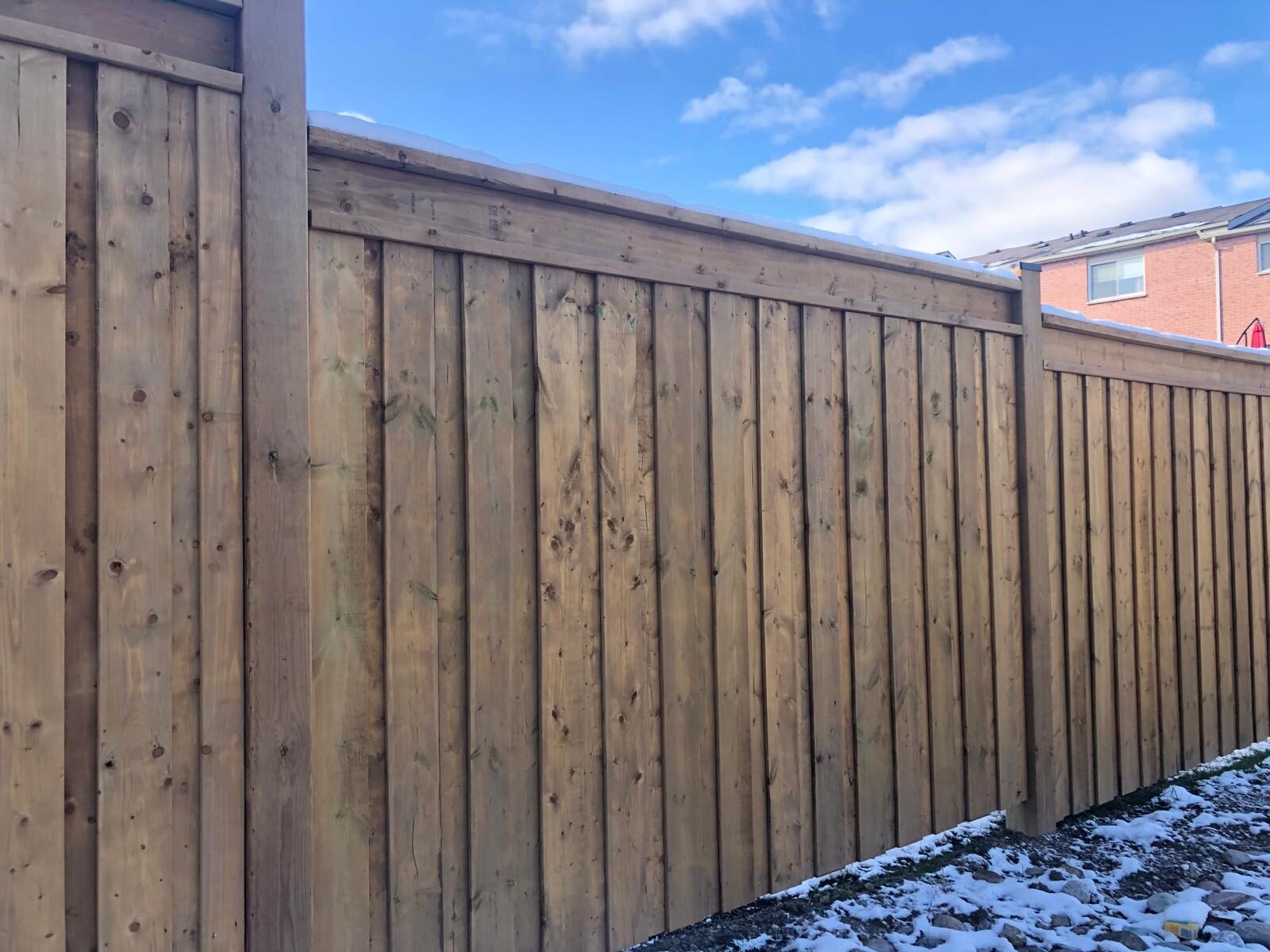 Completed cedar wood privacy fence installed by Ramirez Landscaping in the Greater Toronto Area