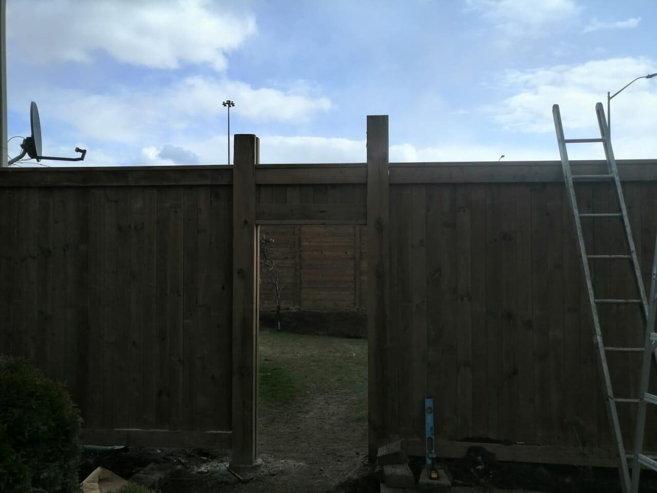Completed cedar wood privacy fence installed by Ramirez Landscaping in Toronto, ON