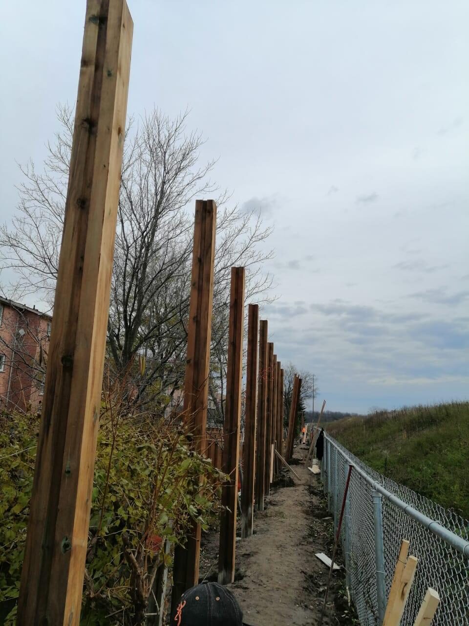 Backyard fence line before replacement by Ramirez Landscaping in the Greater Toronto Area