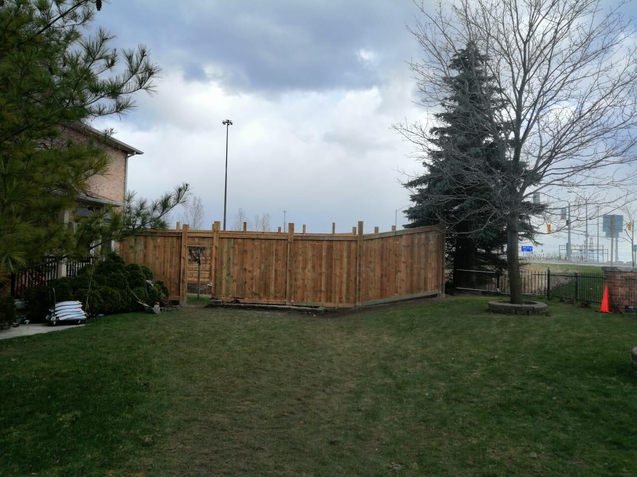 Completed cedar wood privacy fence installed by Ramirez Landscaping in Toronto, ON