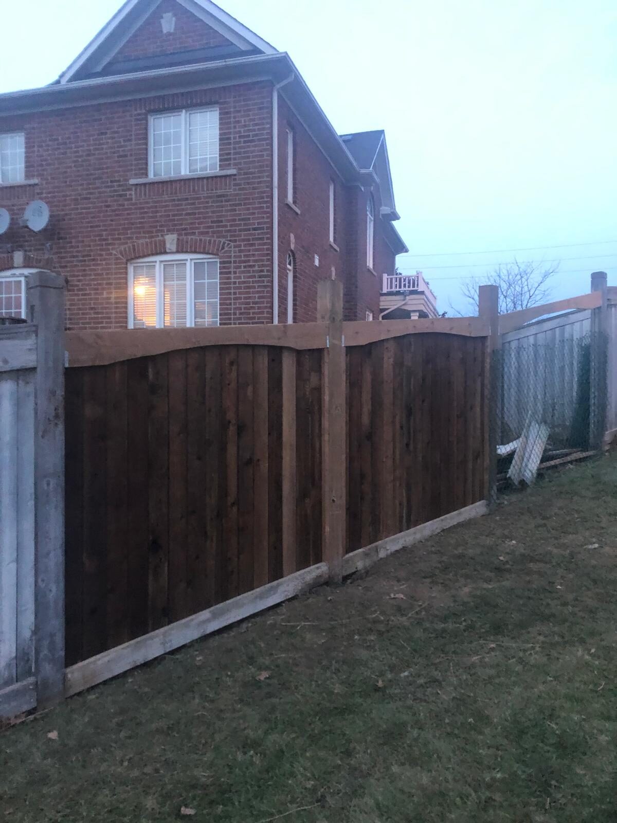 Completed cedar wood privacy fence installed by Ramirez Landscaping in the Greater Toronto Area