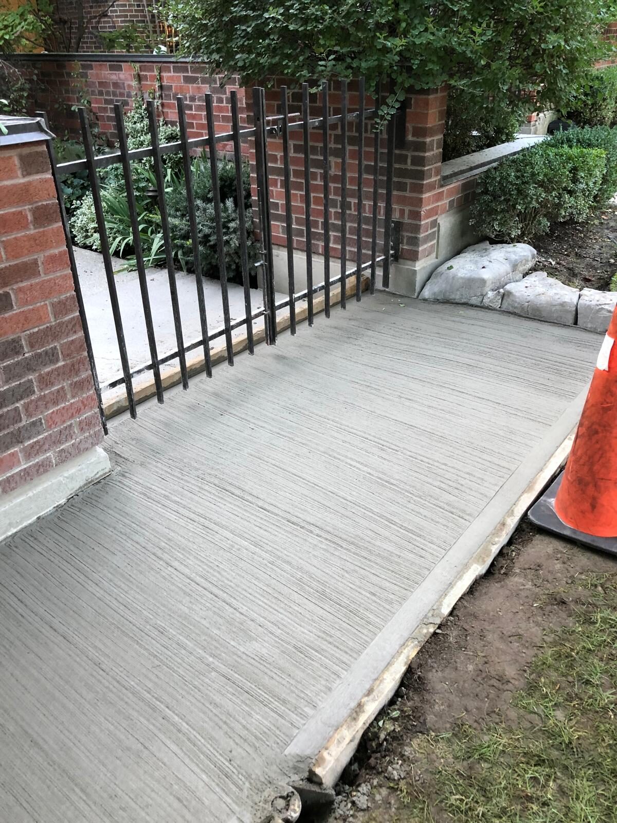 Finished poured concrete driveway by Ramirez Landscaping in Toronto, ON