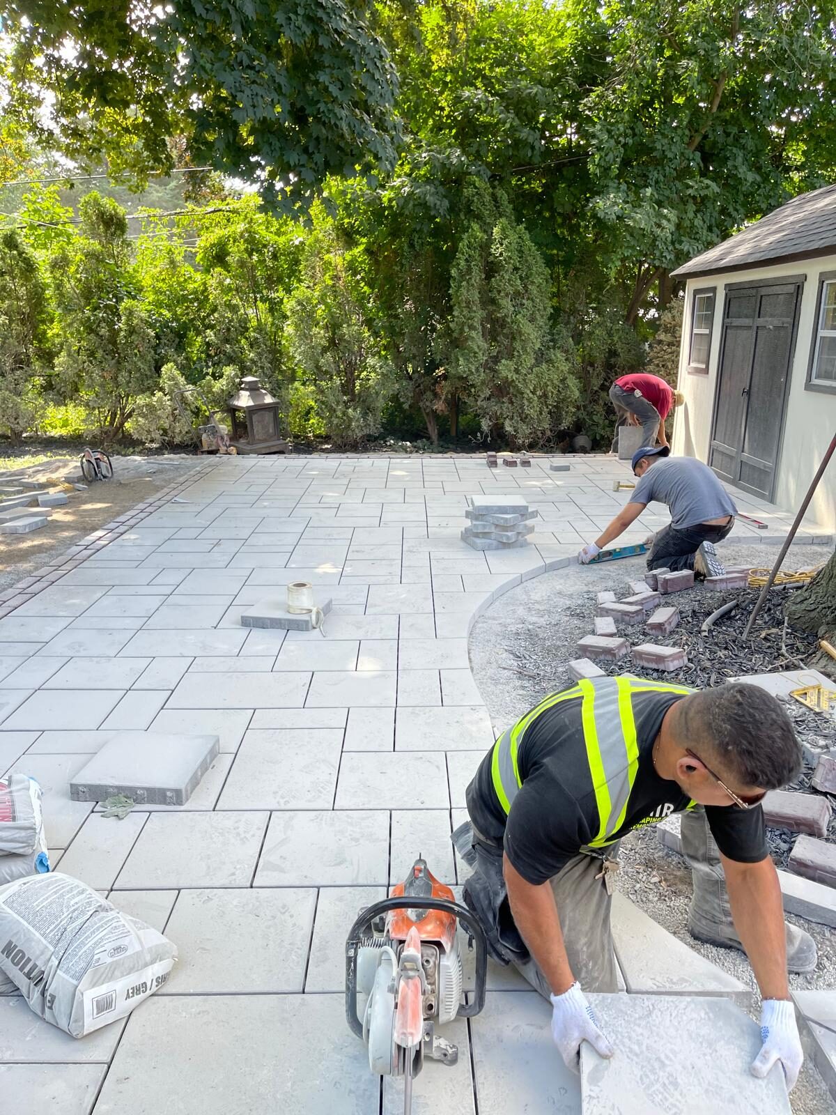 Interlocking paver patio and backyard hardscaping built by Ramirez Landscaping in the Greater Toronto Area