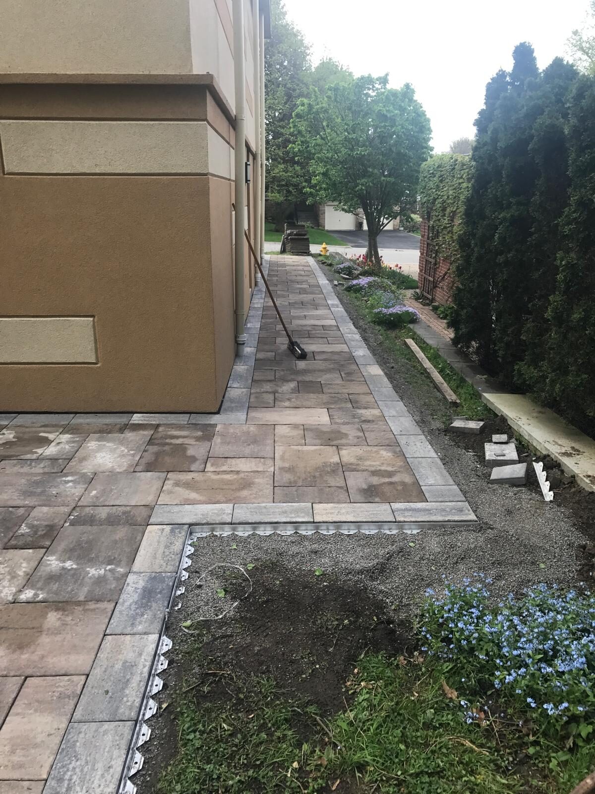 Interlocking paver patio and backyard hardscaping built by Ramirez Landscaping in Vaughan, ON