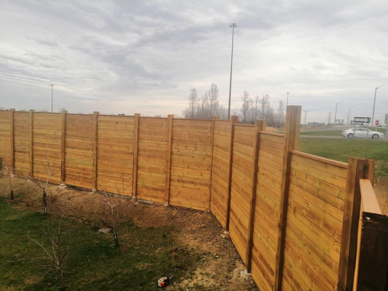Completed cedar wood privacy fence installed by Ramirez Landscaping in Vaughan, ON