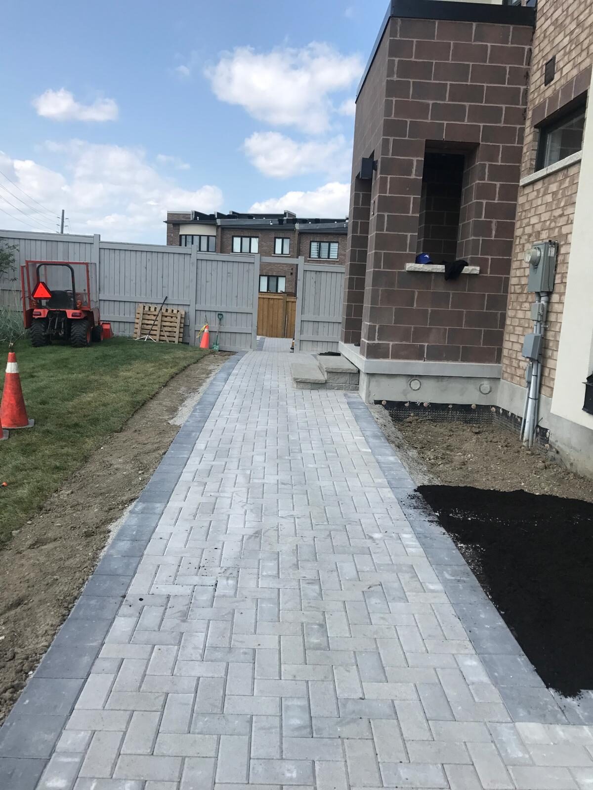Interlocking paver patio and backyard hardscaping built by Ramirez Landscaping in Vaughan, ON